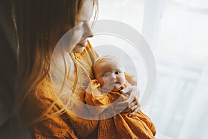 Mother holding baby daughter family lifestyle mom and infant