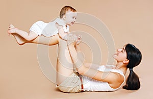 Mother holding baby, fun, exercise, leisure