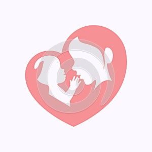 Mother holding a baby in heart shaped silhouette