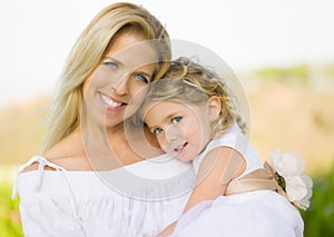 Mother Holding Daughter Flower GIrl