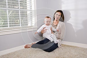 Mother holding happy six month old baby