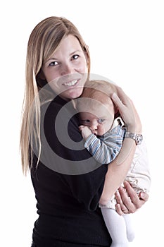 Mother holding her baby with tenderness