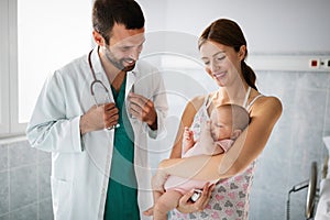 Mother holding her newborn baby child after labor in a hospital