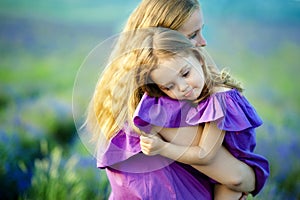 Mother holding his baby. Selective focus on baby head.