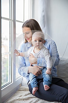 Mother is Holding and Hugging His Baby Daughter