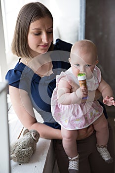 Mother is Holding and Hugging His Baby Daughter