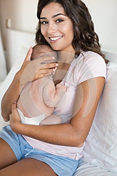 Mother holding newborn baby