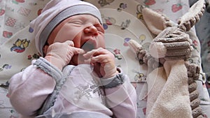 Mother Holding Newborn in Embrace and Breastfeed Her Infant, Close-up View of Baby Head, Tenderness and Care of Motherhood.