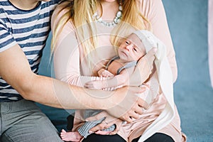 Mother holding newborn on hands