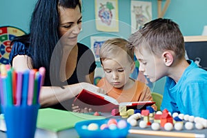 Mother homeschooling her children photo