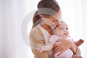 Mother, hug and baby with love, support and care for family, bonding and maternity at home. Happy mom, parent or woman