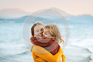 Mother hugging with child daughter family lifestyle happy emotions travel together summer vacations