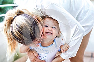 Mother hugging her baby girl - Mom having fun with her daughter - Family concept