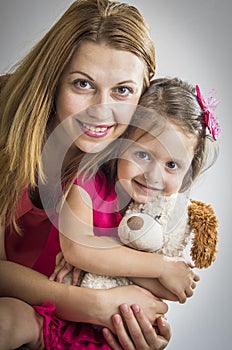 Mother hugging her daughter