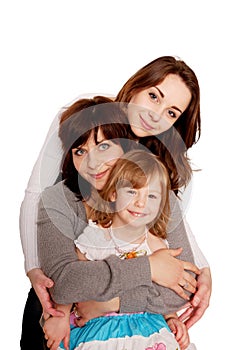 Mother hugging with two daughters.