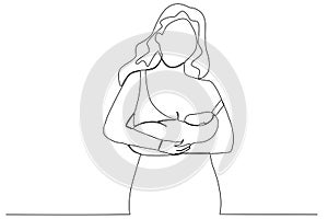A mother hugs her child while breastfeeding
