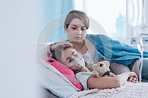 Mother and kid with cystic fibrosis photo