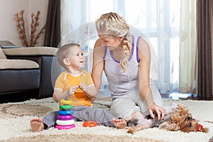 Mother and kid have pastime together indoor photo