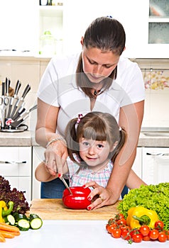 Mother and kid preparing healthy food