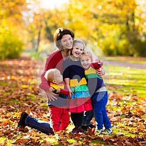 Mother and kids in autumn park