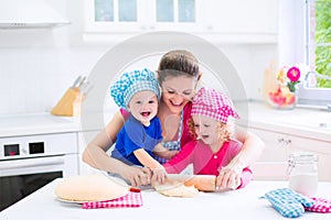 Mother and kids baking a pie