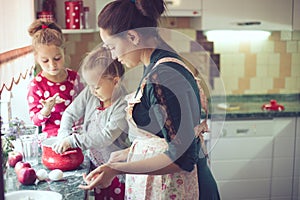 Mother with kids at the kitchen