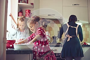 Mother with kids at the kitchen