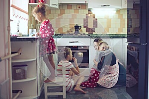 Mother with kids at the kitchen