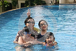 Mother and kids in the pool