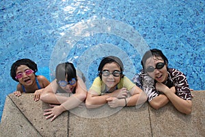 Mother and kids in the pool