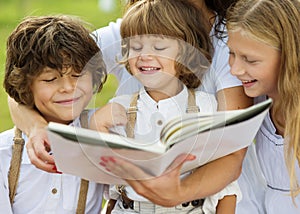 Mother and kids reading a book