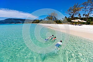 Mother and kids snorkeling