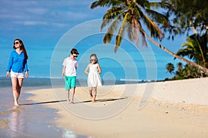 Mother and kids on a tropical beach