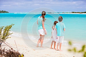 Mother and kids on a tropical beach