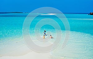 Mother and kids at tropical beach