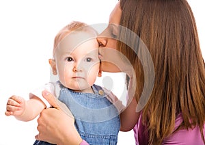 Mother kissing baby boy