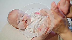 Mother Kissing Baby`s Feet