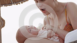 Mother kissing beloved baby daughter