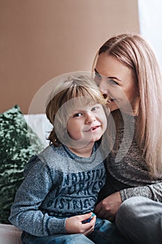 Mother is kissing his son. Mom and son. Happy mother`s day. Mother hugging her child