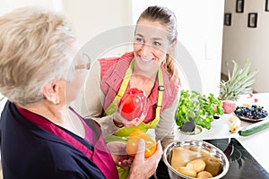 Mother in law explaining correct use of bell pepper in kitchen t