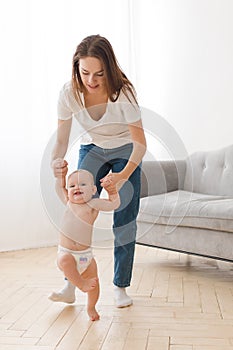 Mother learning child to walk