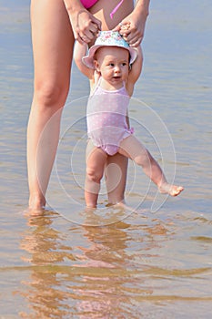 Mother learning child to walk