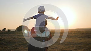 Mother with little boy hiking adventure with child on family trip. A woman with a backpack is traveling with child. Hike