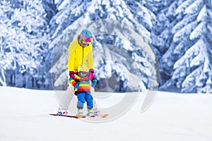 Mother and little boy learning to ski