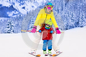 Mother and little boy learning to ski