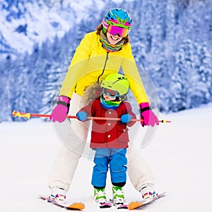 Mother and little boy learning to ski