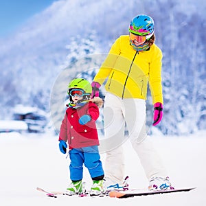 Mother and little boy learning to ski