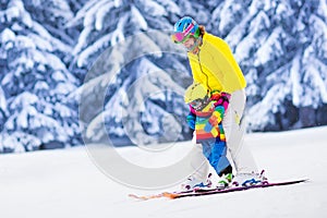 Mother and little boy learning to ski