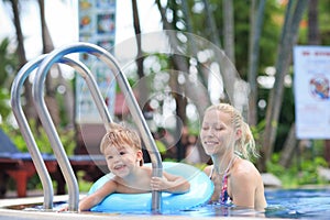 Mother and little boy in a pool