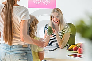 Mother and little boy during a visit to a dietitian preparing a healthy diet plan